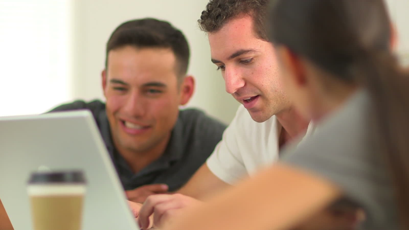 Frame from the Arvato film, real filmed footage of hands typing on a laptop