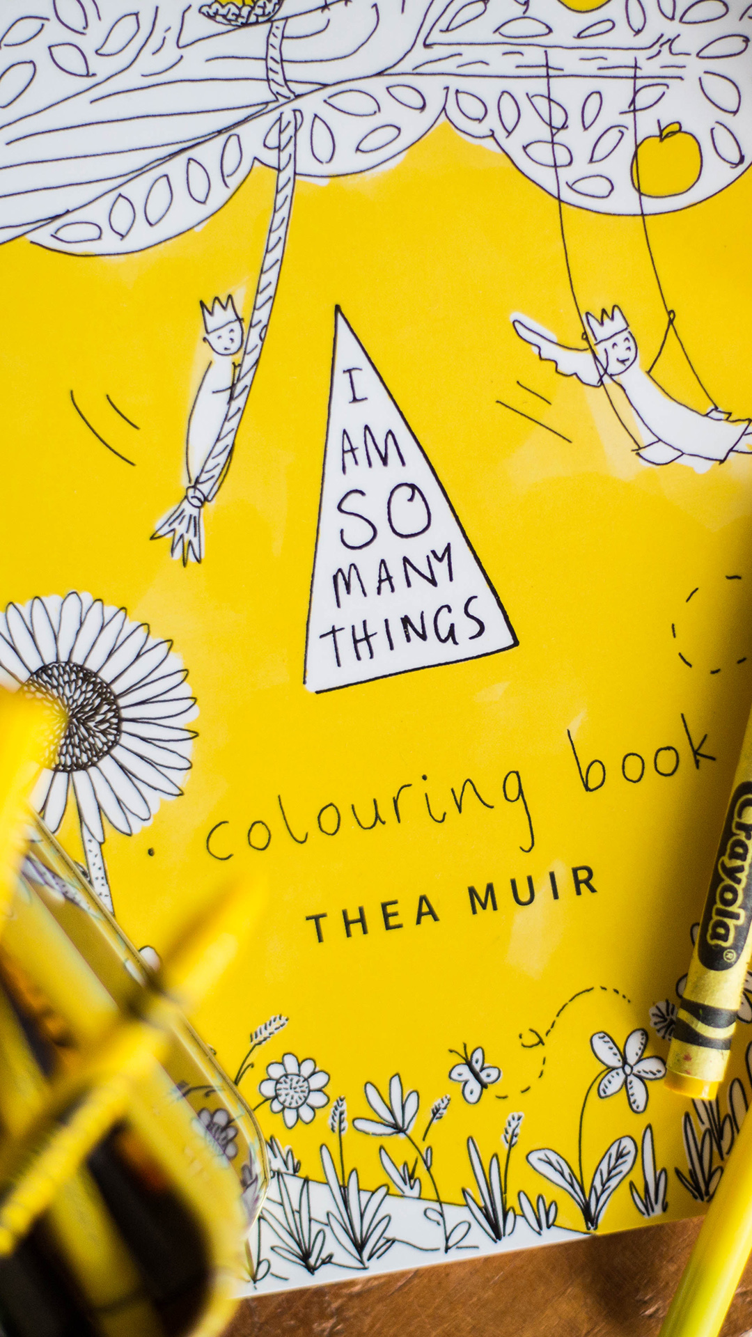 Hand drawn triangle title card reading 'I Am So Many Things', the same mark used on the book's own cover