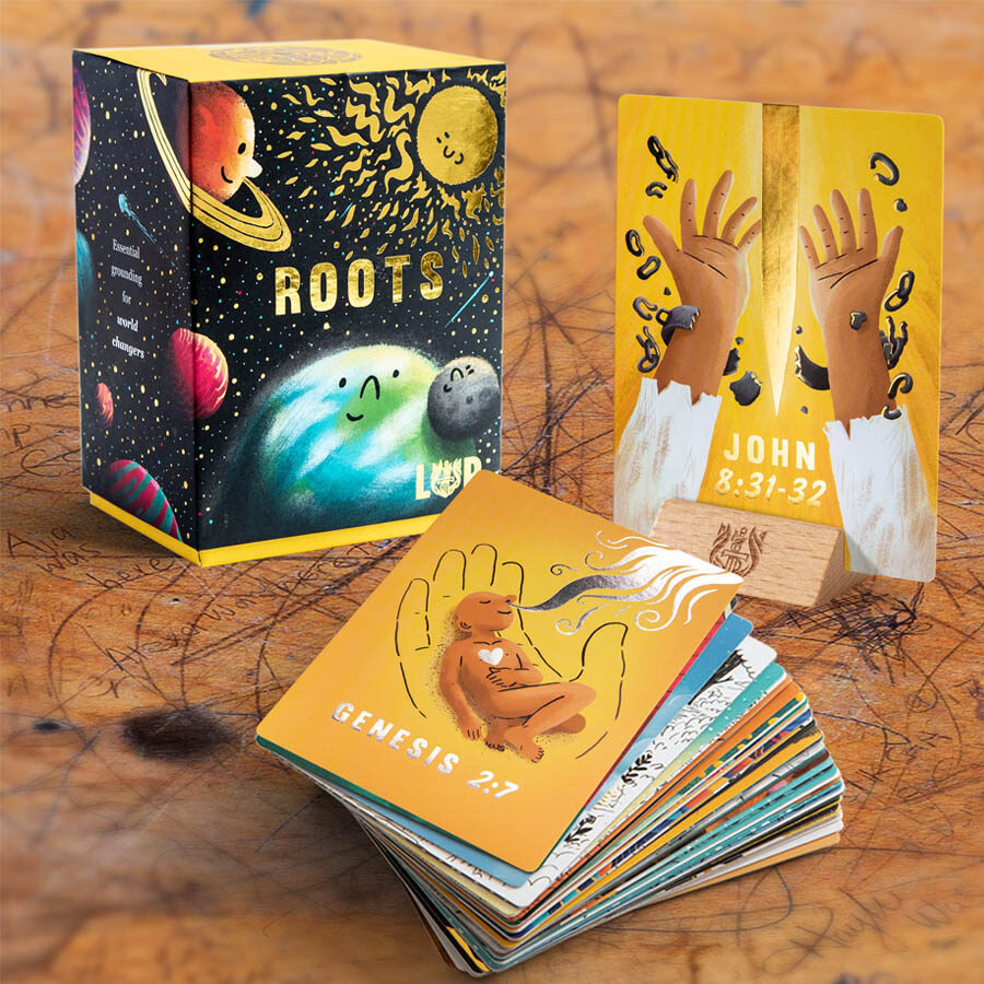 'Roots' boxed card set for Living & Powerful, illustrated with painted planets against a night sky